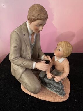 Vintage Treasured Memories porcelain figurine titled "The New Train". 1983